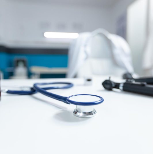 selective-focus-medical-stethoscope-standing-table-ready-disease-consultation-empty-doctor-office-with-nobody-it-equipped-with-professional-examination-tools-medicine-concept